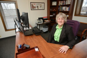 Dr. Joy Frestedt sitting at her office desk